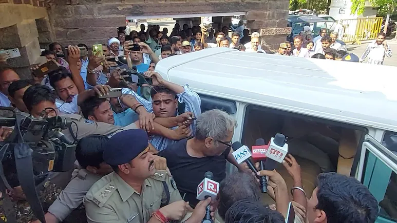 Enraged locals tried to attack Narendra Yadav as he was escorted to a local court.